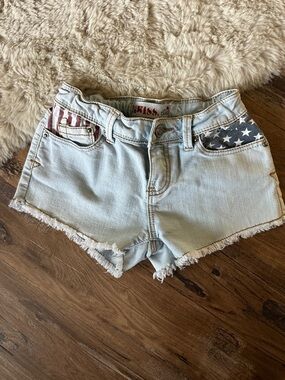 1st Kiss Light Blue Denim Shorts with Red & Blue Flag Pocket Accents